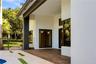 Covered patio featuring wood-finish flooring, recessed lighting, and large-format tile decking