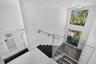 GLASS RAIL OVERLOOKING THE LIVING ROOM