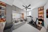 Private balcony featuring horizontal metal railings and sliding glass doors