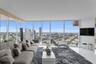Floor-to-ceiling glass walls, expansive urban scenery, white polished flooring, and mirrored wall panels