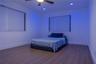 Wood-finish flooring, recessed lighting, ceiling fan with integrated light, and dual windows with pleated shades