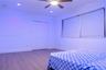 Room featuring wood-finish flooring, recessed lighting, a ceiling fan with integrated lighting, and a bi-fold closet