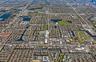 Aerial perspective featuring a gridded urban layout, established residential density, integrated waterway systems, and proximity to regional commercia