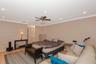 Spacious master bedroom featuring light-toned wood-finish flooring, recessed lighting, crown molding, and a central ceiling fan