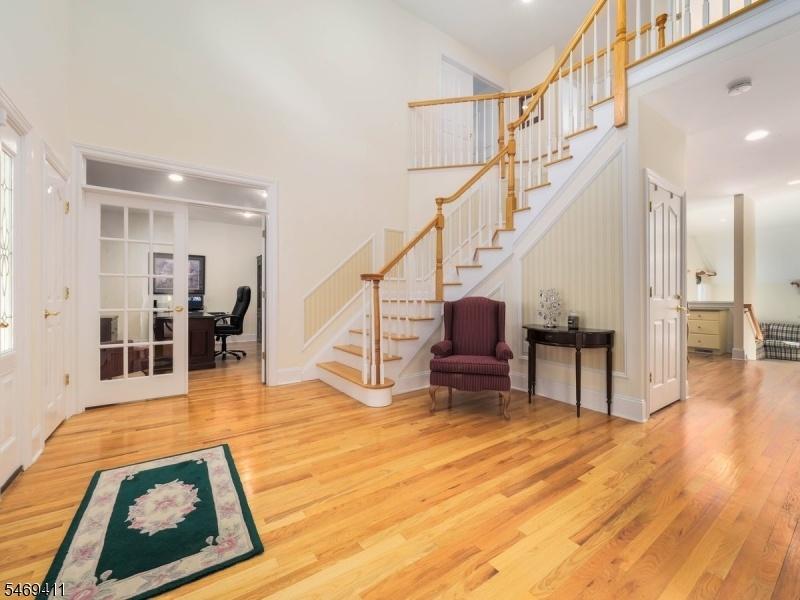 Grand foyer with custom stairs