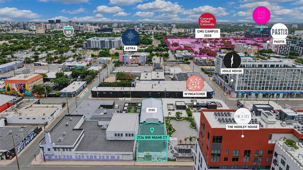 Aerial perspective of the urban landscape featuring proximity to major thoroughfares, established campus facilities, and regional retail and residenti