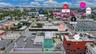 Aerial perspective of the urban landscape featuring proximity to major thoroughfares, established campus facilities, and regional retail and residenti
