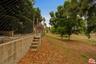Steps down to city owned open 
