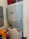 White stackable washer and dryer unit with rotary controls