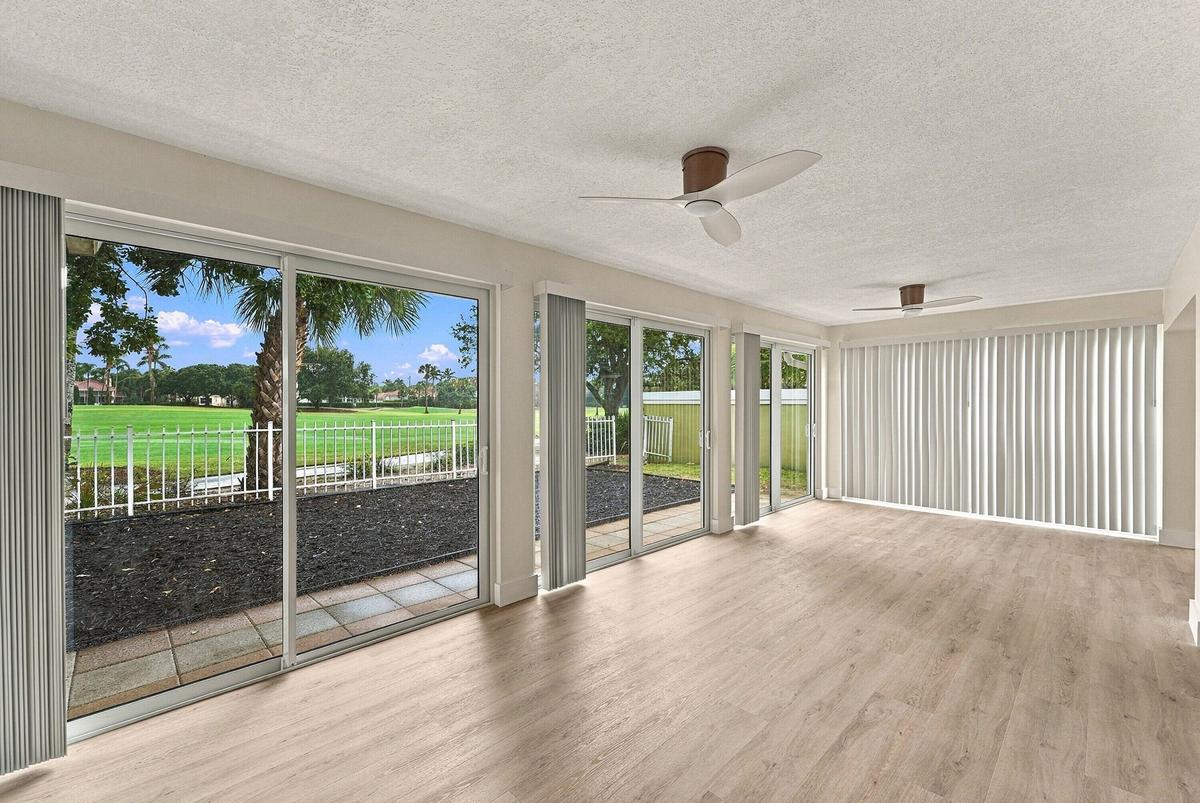 The patio was enclosed to add additional living space along with brand new impact windows.