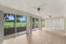 The patio was enclosed to add additional living space along with brand new impact windows.