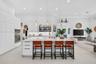 Kitchen featuring white shaker-style cabinetry, a large central island with a stone countertop, built-in stainless steel double ovens, recessed lighti