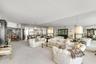 Expansive room featuring floor-to-ceiling wall mirrors and custom curved architectural detailing