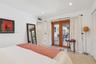 Interior space featuring glass-paned wood-framed double doors, recessed lighting, and terrazzo flooring