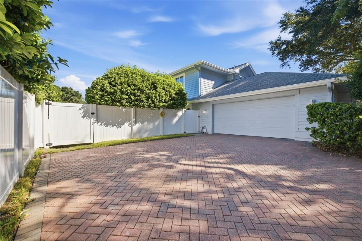 Two Car Garage with Side Entry, allows for additional parking. Concrete Paver Driveway