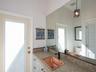 1/2 bath adjacent to laundry room with door out to pool area