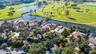 aerial of house on golf course and pond