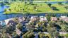aerial of house on golf course and pond