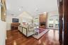Great Room offering 14' ceilings, wood flooring and a wood-burning fireplace.