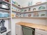 walk in pantry and small appliance closet with built in desk