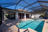 Pool area patio on side wraps around to back patio
