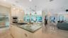 Kitchen looking out to the living area and dining room and expansive waterviews