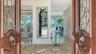 Enter through double custom oak doors