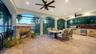 Outdoor living off the family room, with screening so no bugs allowed in while dining or relaxing by the gas fireplace