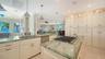 floor to ceiling cabinets, kitchen opens to family room