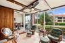 One of a kind outdoor space showcases beautiful African Mahogany trim, teak wall panels, and an impressive 14 coats of varnish, reflecting the craftsm