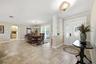 Welcoming foyer opens up to formal dining and family room