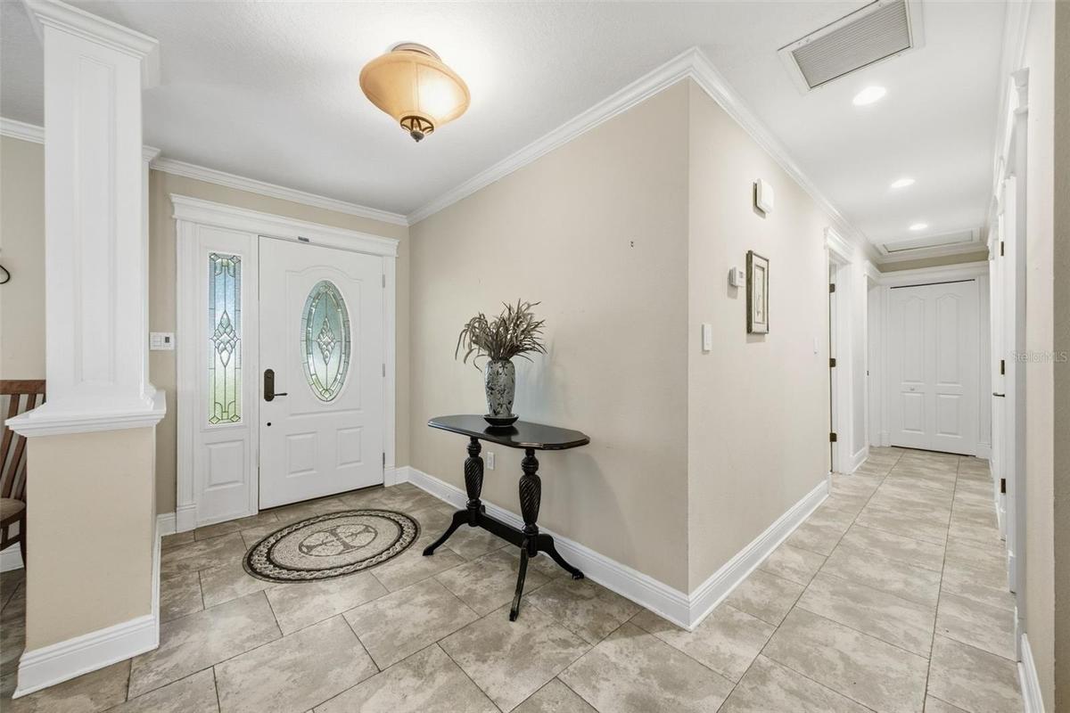 Hallway leads to 3 bedrooms and 2 baths.  Primary suite on opposite side of house.