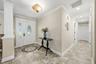 Hallway leads to 3 bedrooms and 2 baths.  Primary suite on opposite side of house.