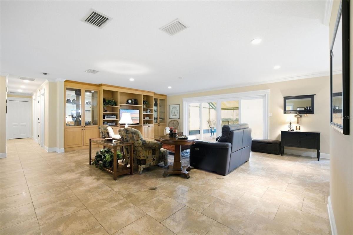 Spacious living area overlooking large lot and screened lanai