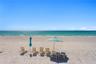 Enjoy the exceptional beachfront lifestyle with private access to the pristine shores of Longboat Key.