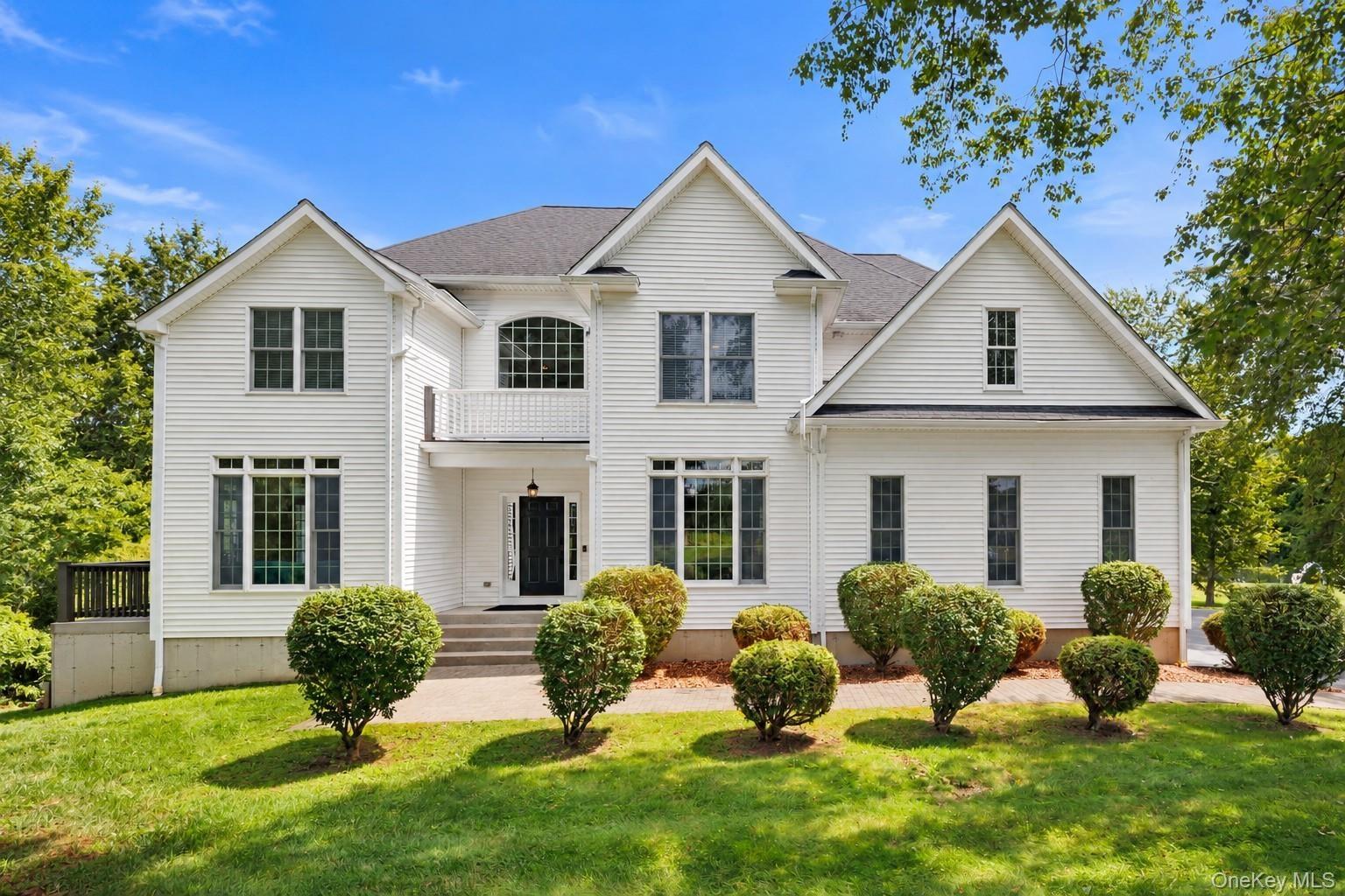 This impressive Colonial-style residence blends timeless elegance with gracious living, offering a welcoming setting for memorable gatherings, effortl