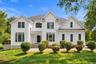 This impressive Colonial-style residence blends timeless elegance with gracious living, offering a welcoming setting for memorable gatherings, effortl