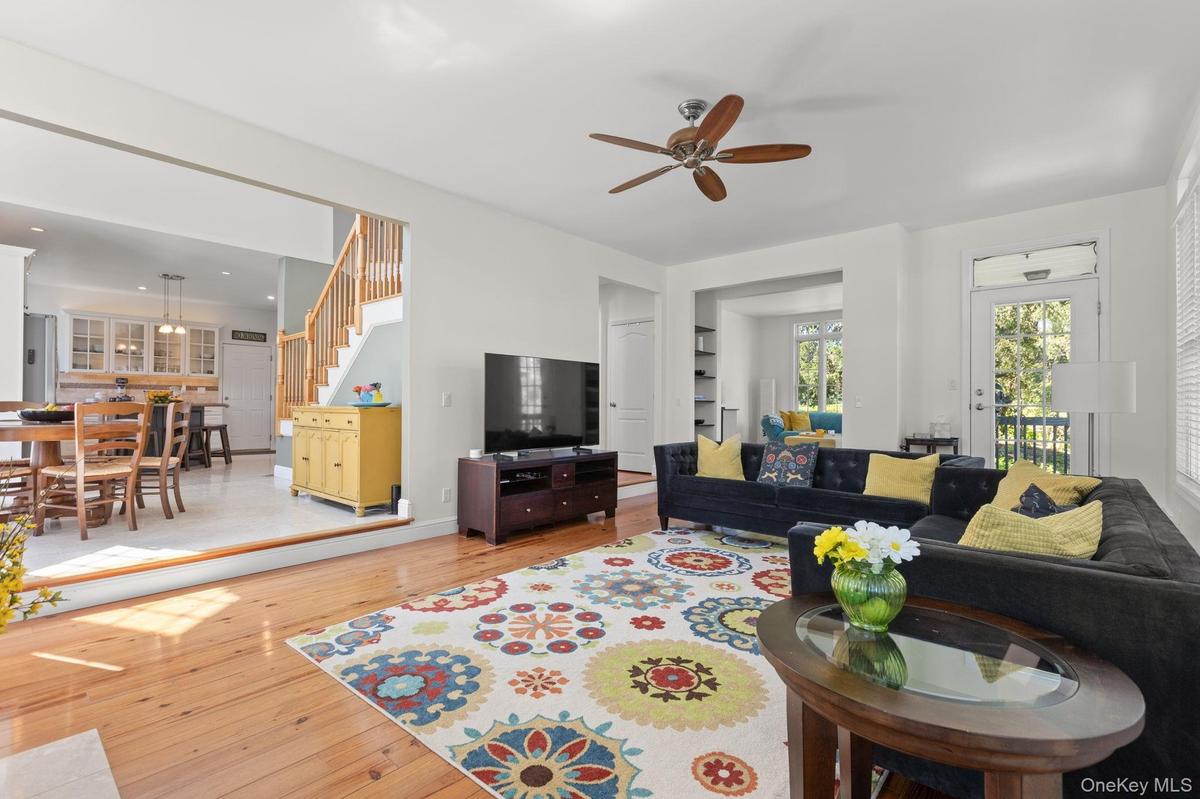 Conveniently located adjacent to the kitchen and dining area, this inviting space offers effortless access and a seamless flow for everyday living and