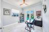 4th bedroom with hurricane french doors opening to pool area - also has fabric hurricane shutters for added protection