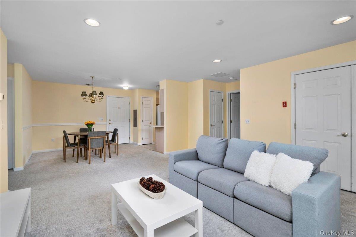 Wide living room with seamless flow to the kitchen, dining and bedrooms