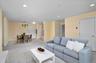 Wide living room with seamless flow to the kitchen, dining and bedrooms