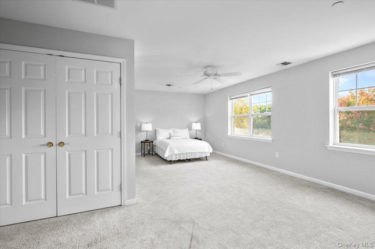 Bright, oversized primary bedroom.