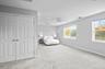 Bright, oversized primary bedroom.