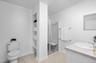 A primary bathroom with space
