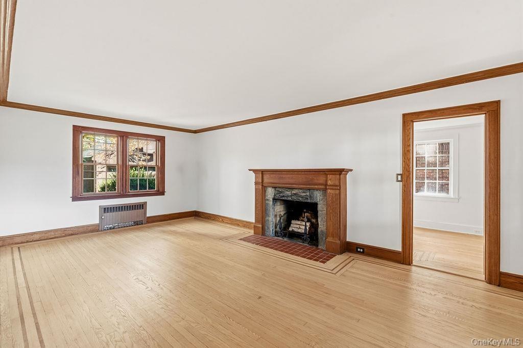 Sun-lit Living Room with wood burning fireplace