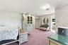 Built-in floor-to-ceiling cabinetry, recessed lighting, and patterned wall coverings