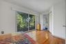 The Primary Bedroom has sliding glass doors that go out to a second floor porch