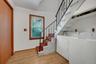 The double closet and washer / dryer are located in the hallway along with the staircase that goes up to the second floor bedrooms.