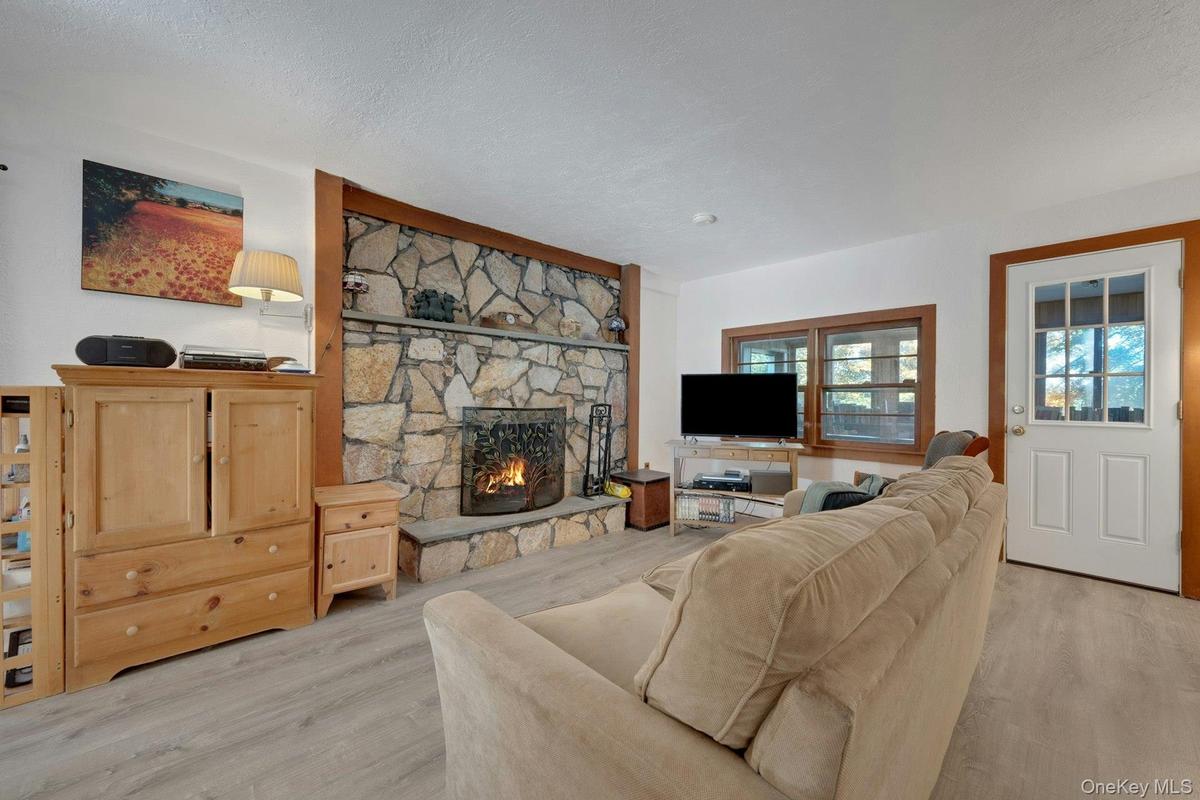 A beautiful stone fireplace is an added bonus.