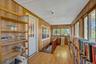 Turn this 3 Season Porch into an office or exercise room. It's sunny and has a gorgeous view.